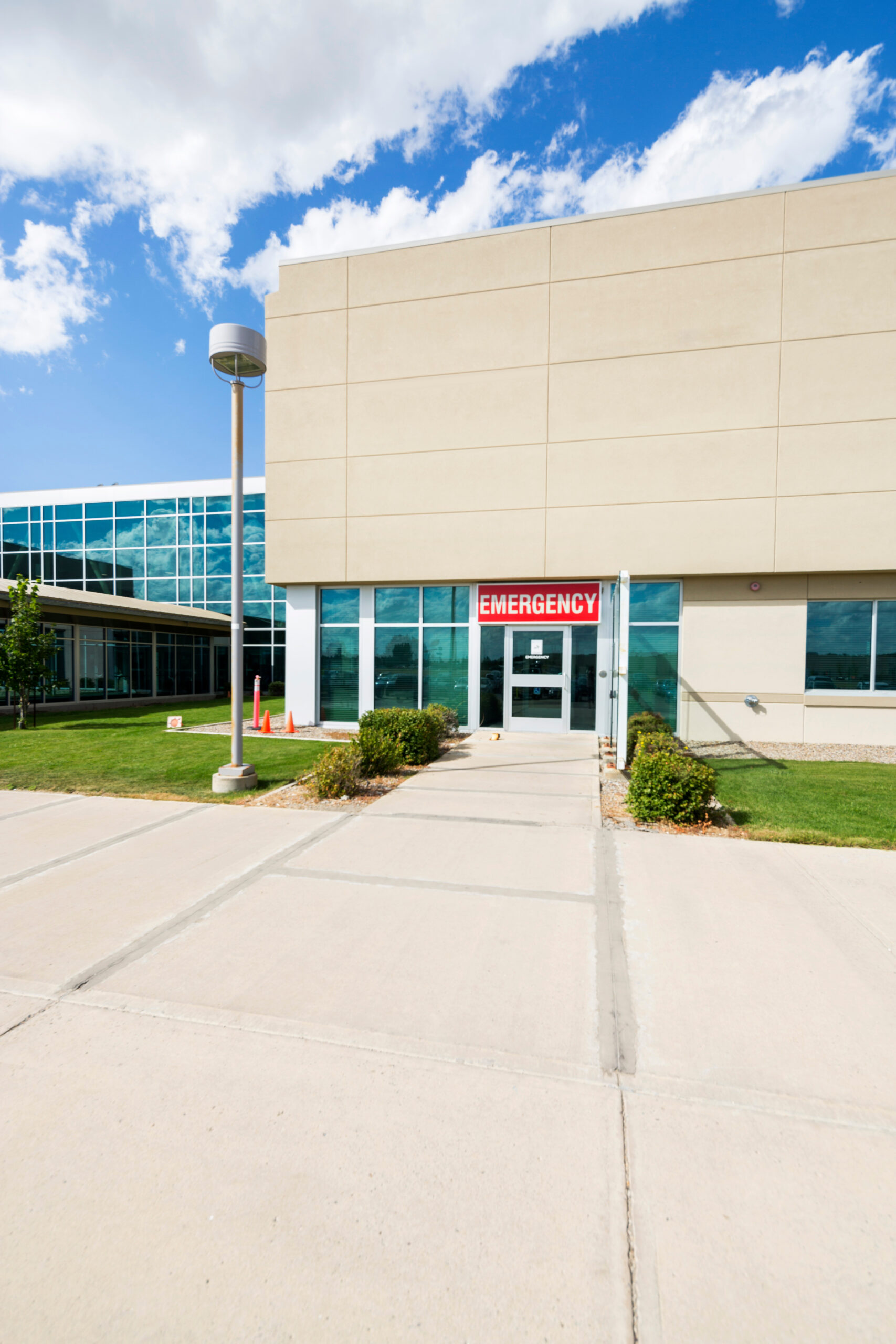 Exterior of modern hospital building with emergency entrance